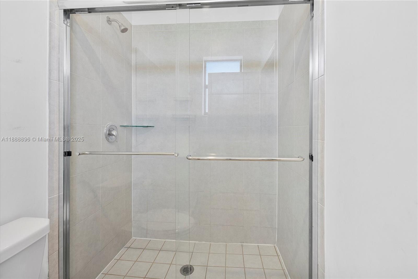 10013 Southwest 228th Terrace, Unit 10013 Miami, FL 33190 - Photo 24 of 39 a bathroom with a shower