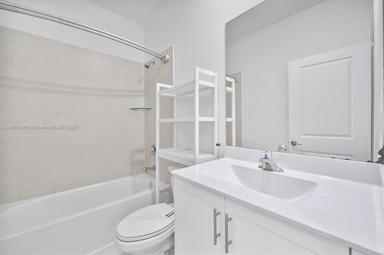 10013 Southwest 228th Terrace, Unit 10013 Miami, FL 33190 - Photo 32 of 39 a bathroom with a sink toilet and shower