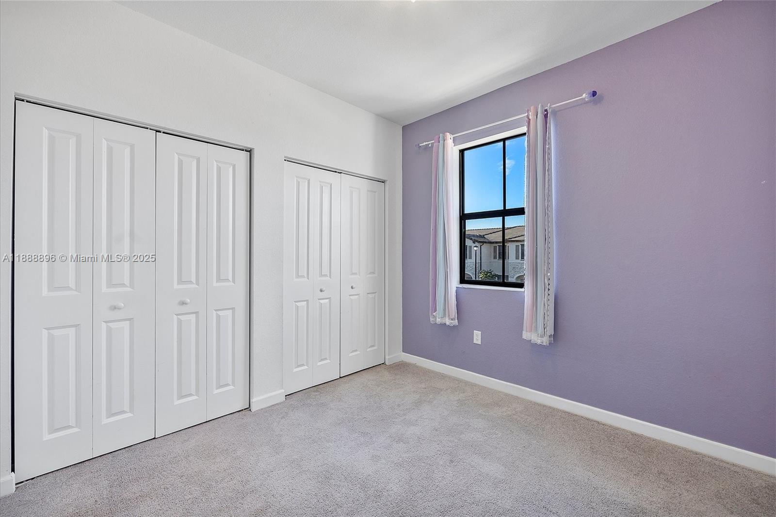 10013 Southwest 228th Terrace, Unit 10013 Miami, FL 33190 - Photo 33 of 39 an empty room with windows