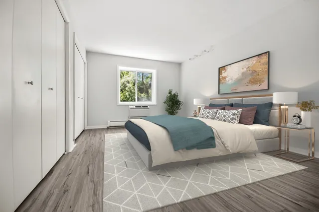 a bedroom with bed and window