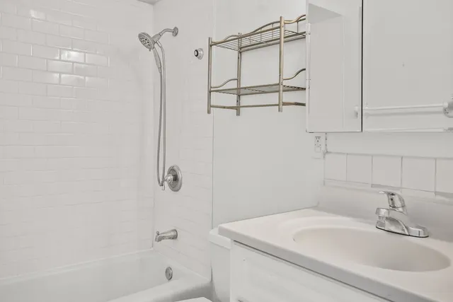 a bathroom with a sink and a shower