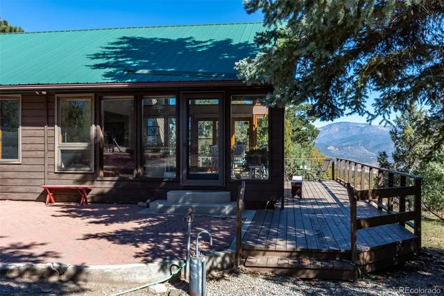 a view of balcony with seating space and wooden floor