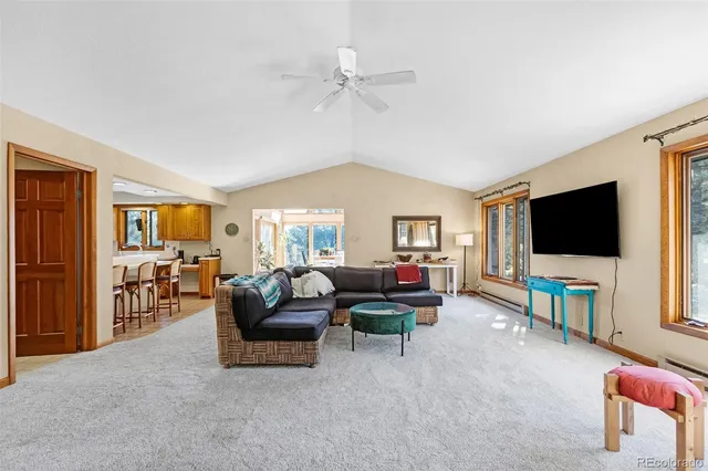 a living room with furniture and flat screen tv