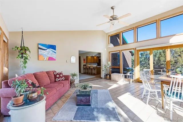 a living room filled with furniture hardwood floor and a large window