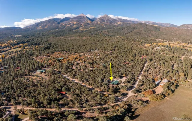 an aerial view of residential house and green space