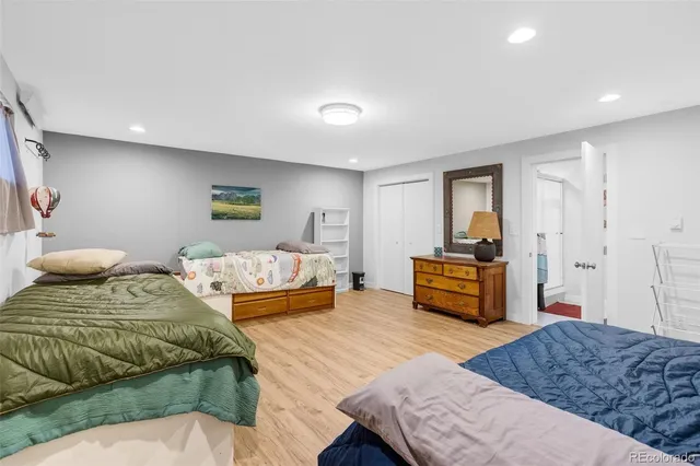 a bathroom with a toilet a sink and a mirror