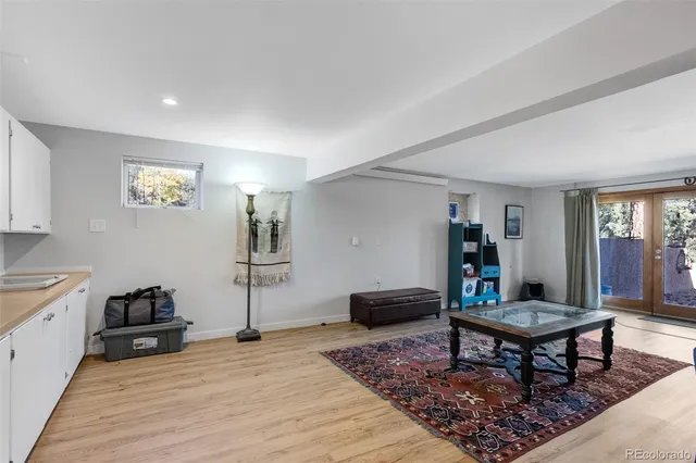 a kitchen with a sink and refrigerator