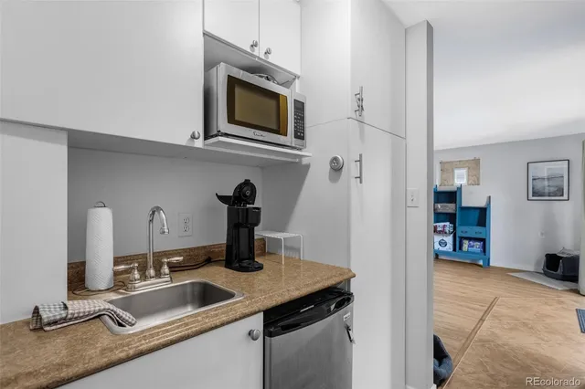 a view of parking garage with cars