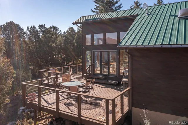 a view of a chairs and table on the deck