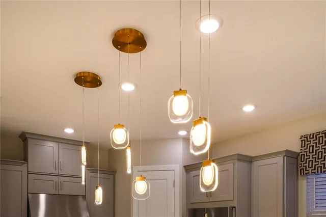 a kitchen with stainless steel appliances kitchen island granite countertop a sink and cabinets