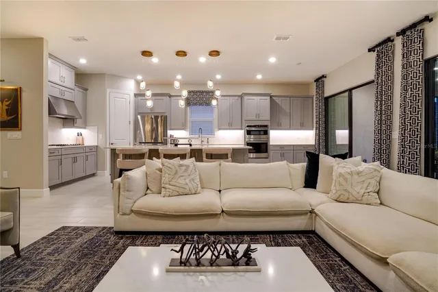 a kitchen with stainless steel appliances kitchen island granite countertop a sink and cabinets