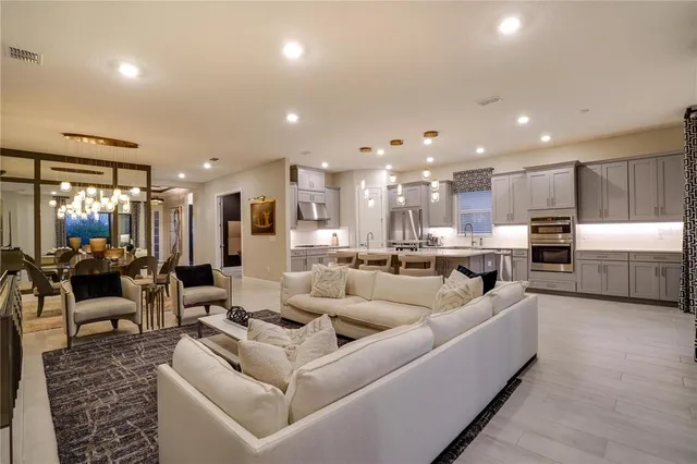 a kitchen with stainless steel appliances a sink and a refrigerator