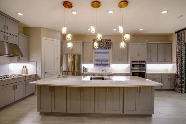 a kitchen with a stove and a microwave