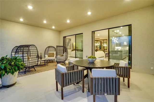 a view of a dining room with furniture wooden floor and chandelier