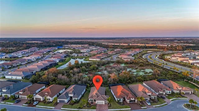 an aerial view of a house with a swimming pool
