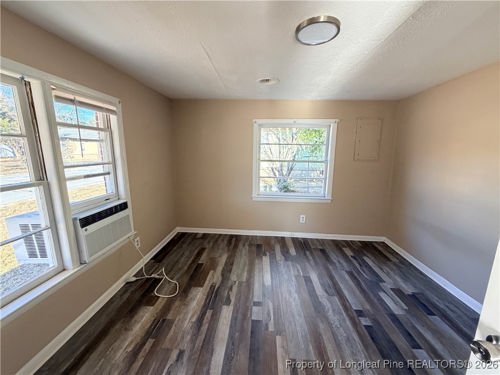 1925 Progress Street Fayetteville, NC 28306 - Photo 6 of 12 an empty room with wooden floor and windows