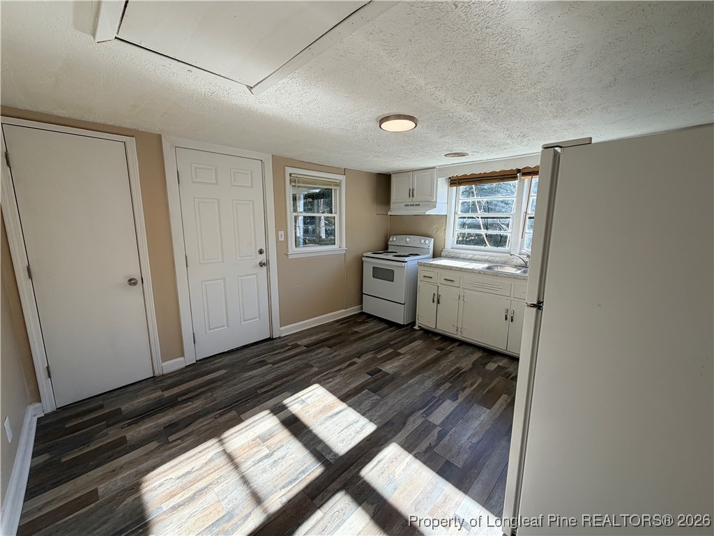 1925 Progress Street Fayetteville, NC 28306 - Photo 7 of 12 a room with storage and utility