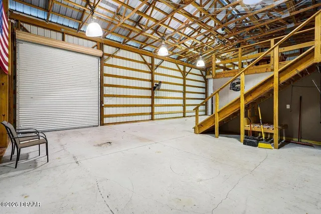 a view of an empty room with stairs