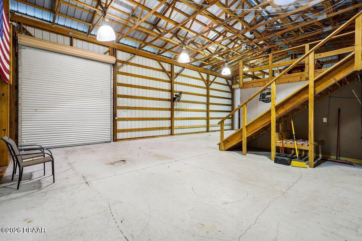 1700 Tomoka Farms Road Port Orange, FL 32128 - Photo 12 of 43 a view of an empty room with stairs