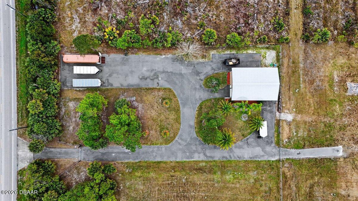 1700 Tomoka Farms Road Port Orange, FL 32128 - Photo 27 of 43 an aerial view of a house with outdoor space