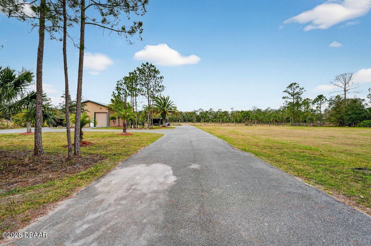 1700 Tomoka Farms Road Port Orange, FL 32128 - Photo 39 of 43 a view of a lake with a yard