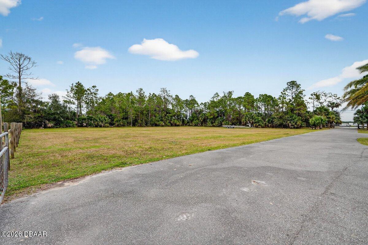 1700 Tomoka Farms Road Port Orange, FL 32128 - Photo 42 of 43 a view of a swimming pool and outdoor space