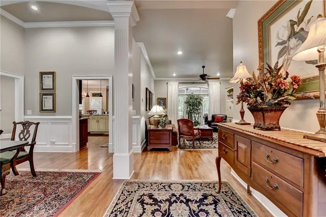 a living room with furniture fireplace and a large window