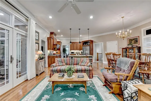 a view of a dining room with furniture and chandelier