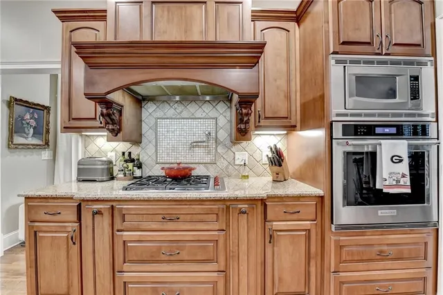 a bedroom with a bed and dresser with mirror