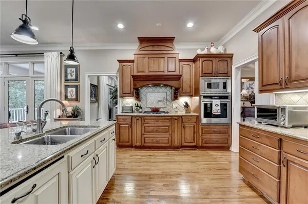 a spacious bathroom with a granite countertop sink and a mirror