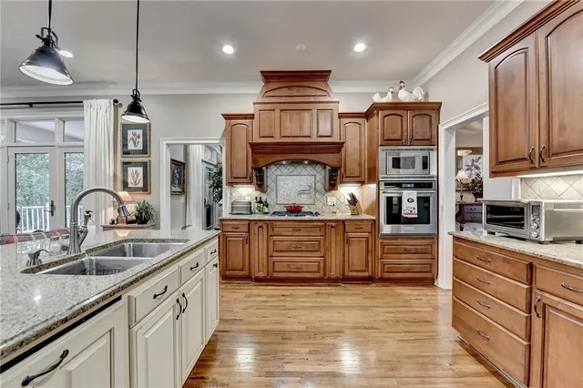 a spacious bathroom with a granite countertop sink and a mirror