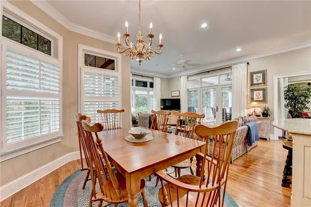 a bathroom with a granite countertop sink a mirror and a shower