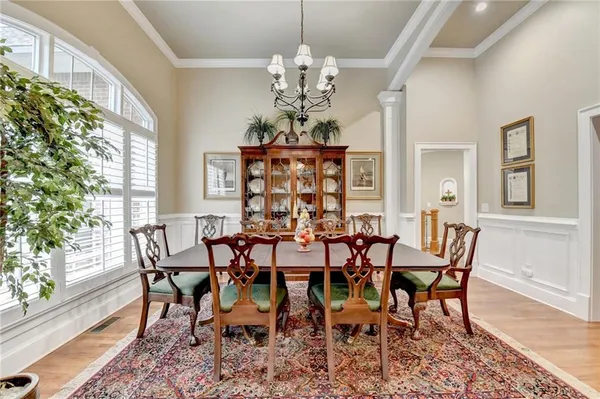 a view of a dining room with furniture window and wooden floor