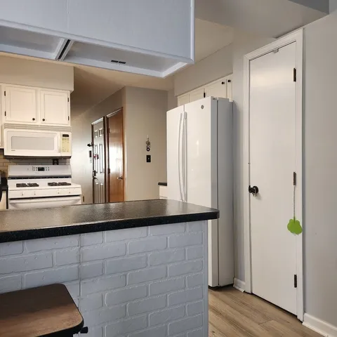 a kitchen with stainless steel appliances a refrigerator and a stove