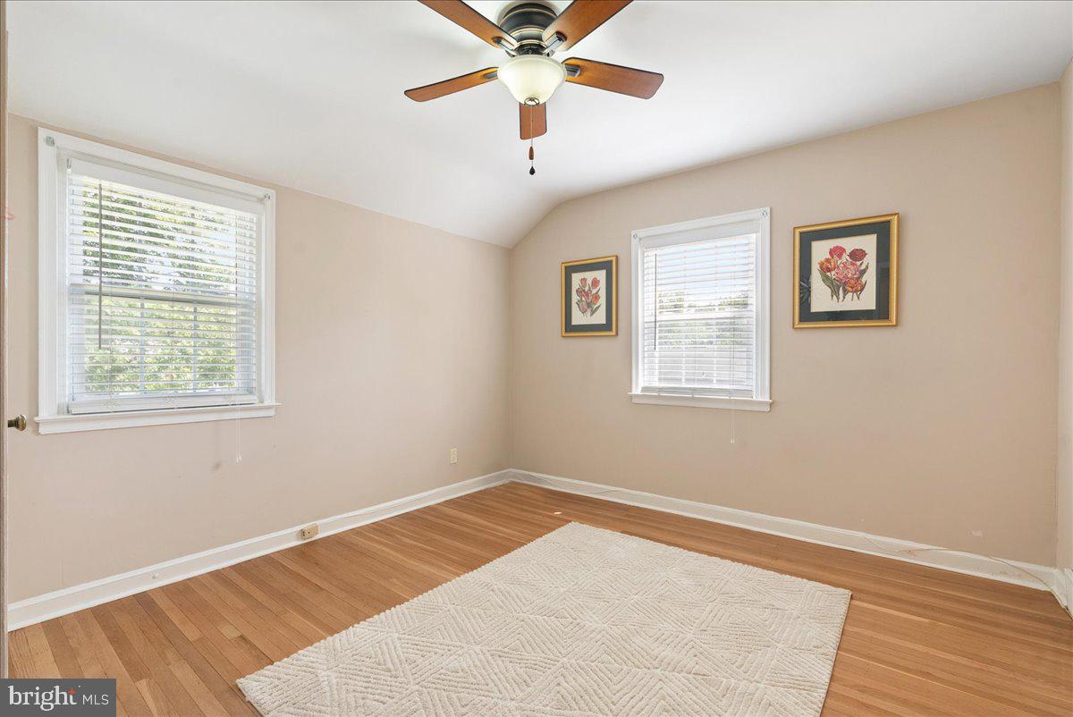 1615 Earlington Road Havertown, PA 19083 - Photo 23 of 72 a view of a room with wooden floor and a ceiling fan