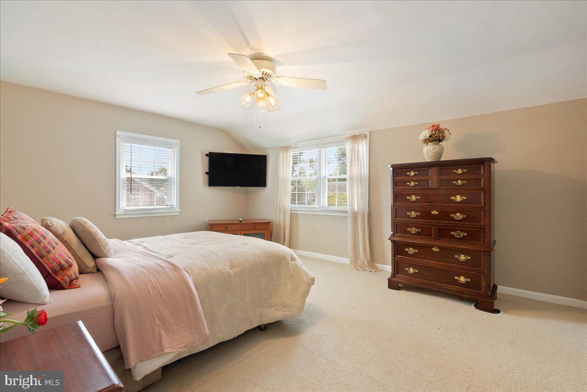 1615 Earlington Road Havertown, PA 19083 - Photo 25 of 72 a bedroom with a bed and a flat tv screen on dresser