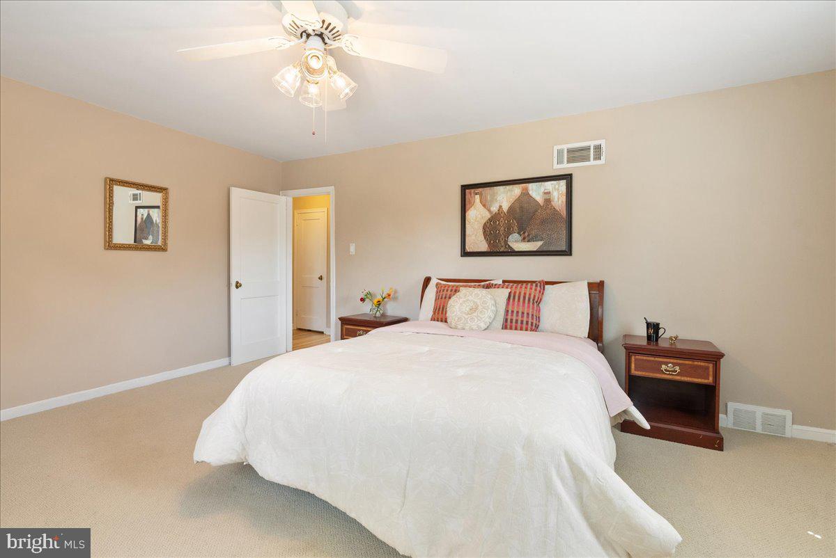 1615 Earlington Road Havertown, PA 19083 - Photo 26 of 72 a bedroom with bed and paintings on the wall
