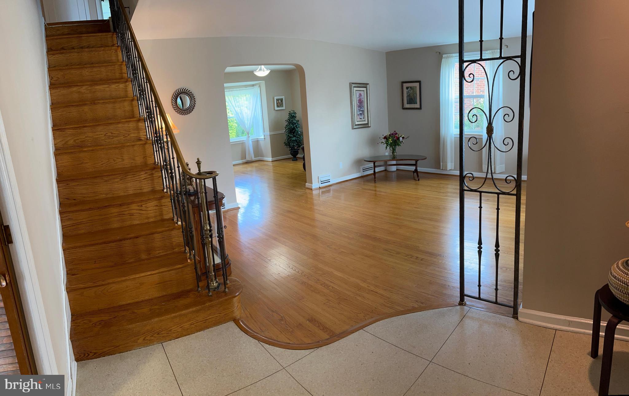 1615 Earlington Road Havertown, PA 19083 - Photo 5 of 72 a view of a hallway with entryway wooden floor and dining room view