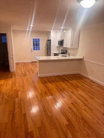 a kitchen with stainless steel appliances granite countertop a sink and cabinets