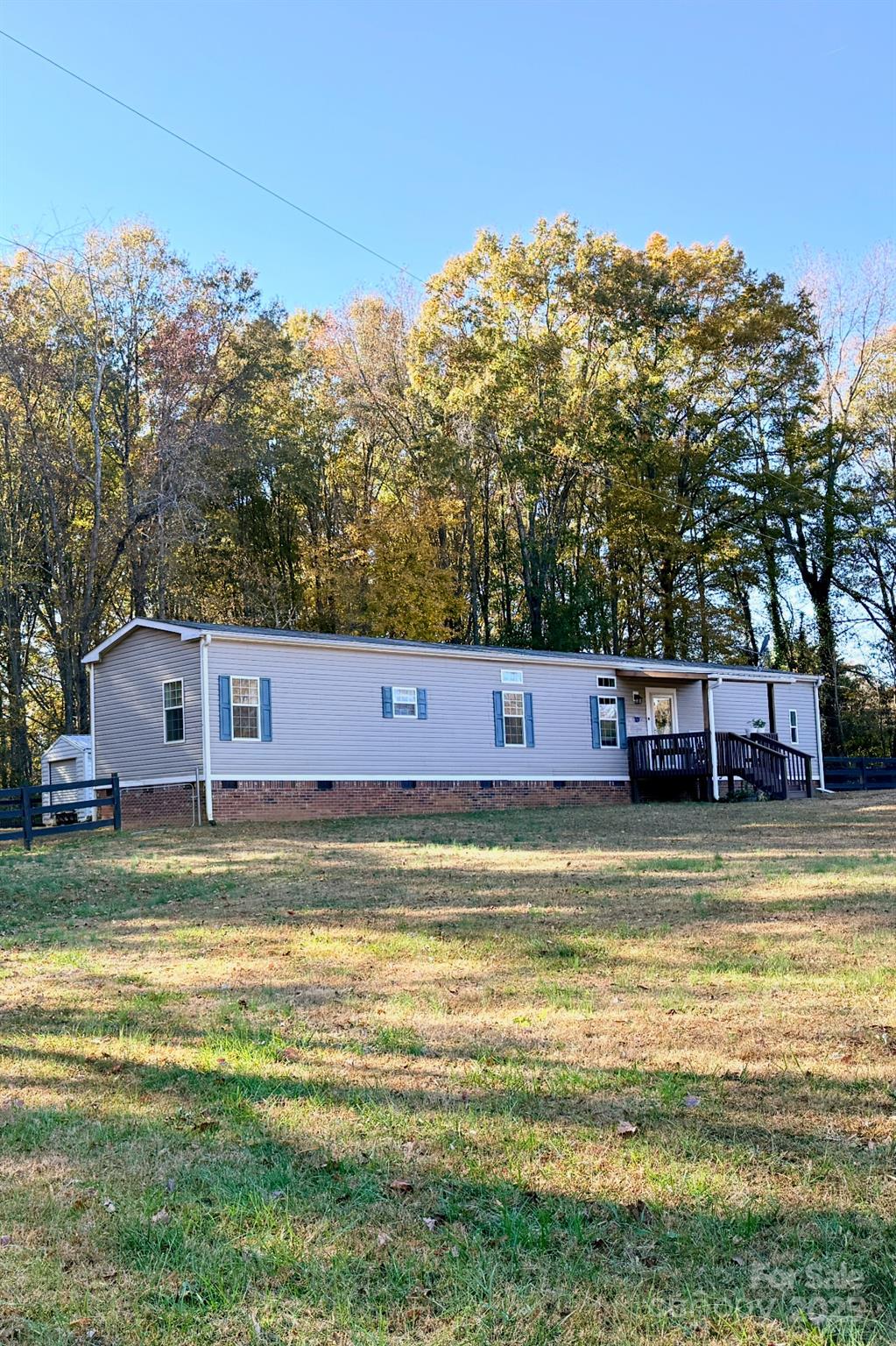 249 Brown Neal Road York, SC 29745 - Photo 1 of 24 a view of a swimming pool with trees in the background