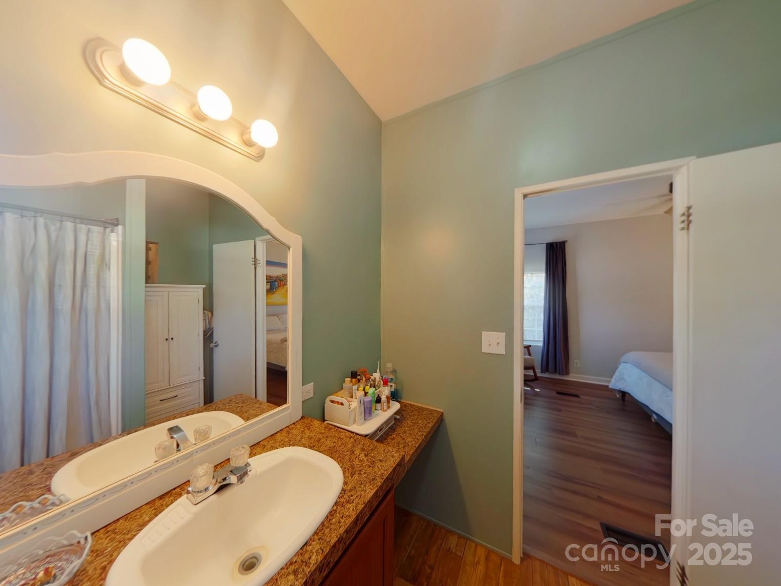 249 Brown Neal Road York, SC 29745 - Photo 11 of 24 a bathroom with a granite countertop sink and a mirror