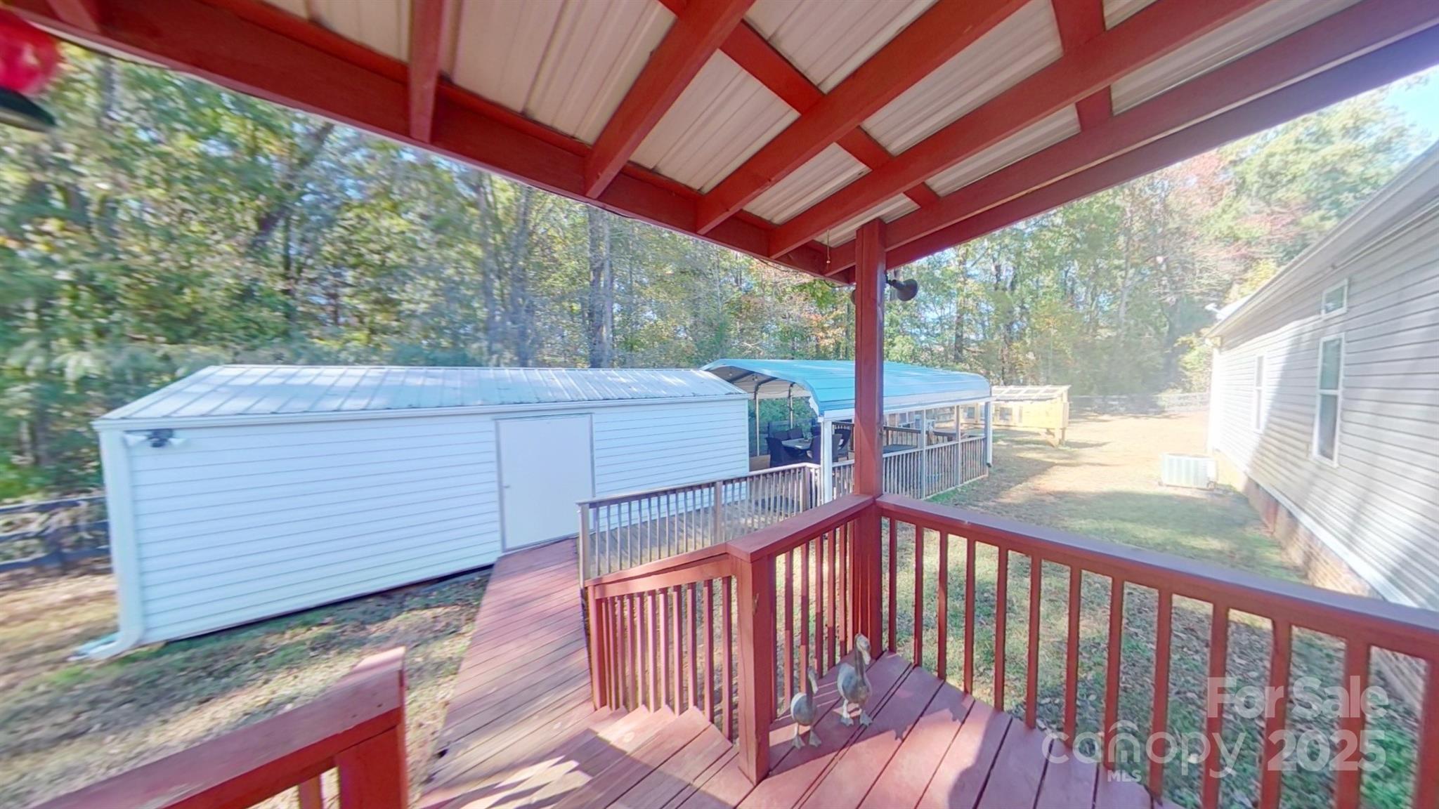 249 Brown Neal Road York, SC 29745 - Photo 17 of 24 a view of a balcony with wooden floor
