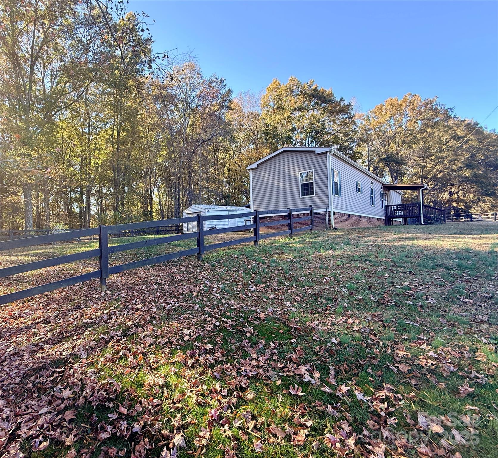 249 Brown Neal Road York, SC 29745 - Photo 23 of 24 a wooden bench sitting in front of a house