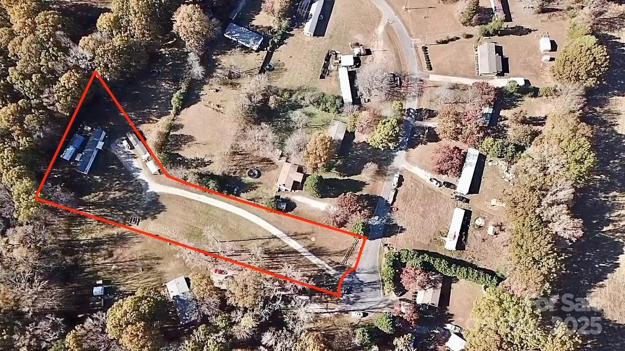 249 Brown Neal Road York, SC 29745 - Photo 24 of 24 an aerial view of a house with a yard and large trees