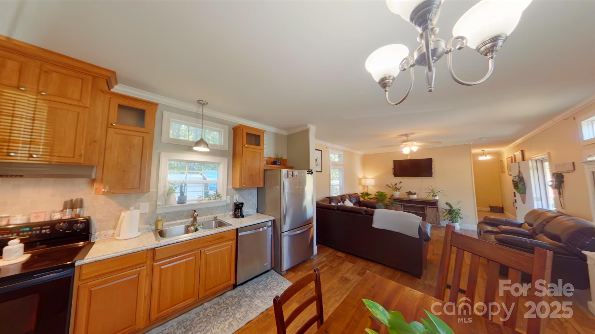 249 Brown Neal Road York, SC 29745 - Photo 6 of 24 a large living room with stainless steel appliances kitchen island granite countertop furniture and a large window