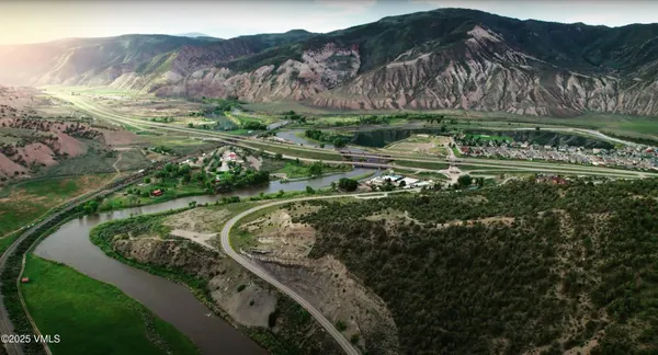a view of a water with a yard and green space