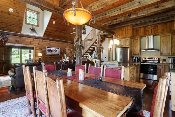 a kitchen with stainless steel appliances granite countertop a stove and a refrigerator