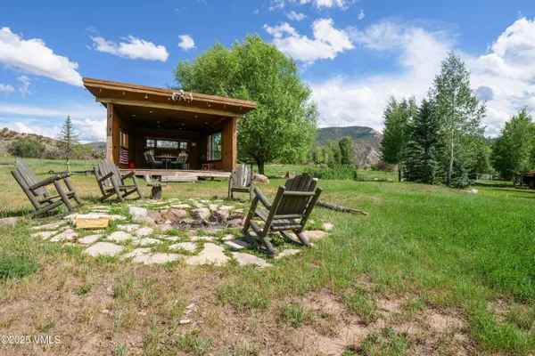 a view of a porch with furniture and wooden floor