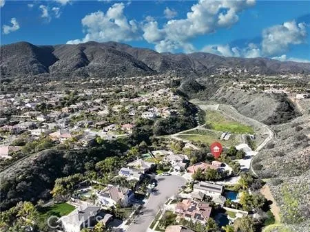 an aerial view of residential house with outdoor space and swimming pool
