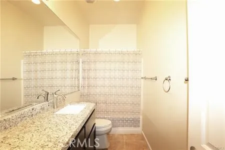 a bathroom with a sink a mirror and a shower